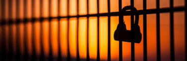 prison bars at sunset