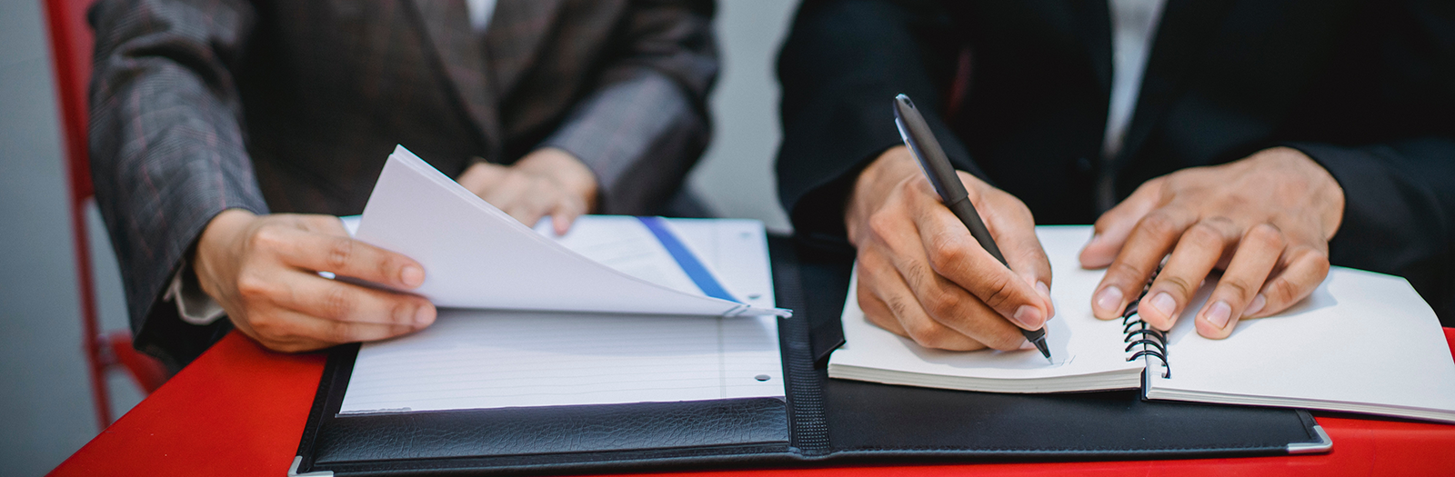 people writing on paper