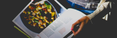 cookbook in hand