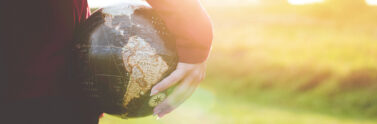 person holding globe