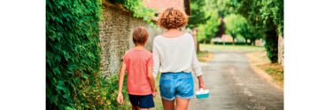 mother and son walking