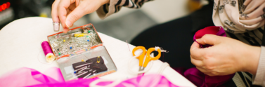 person mending clothes