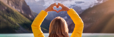 person with heart hand gesture