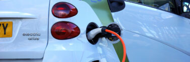 electric vehicle hooked up to charging station