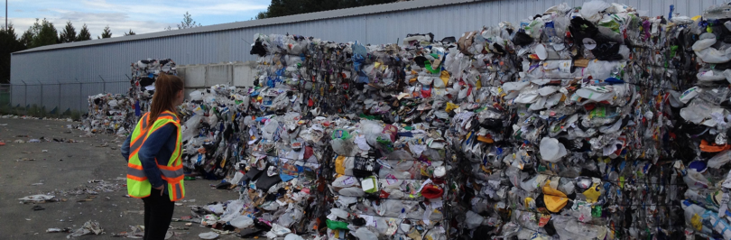 person at recycling depot